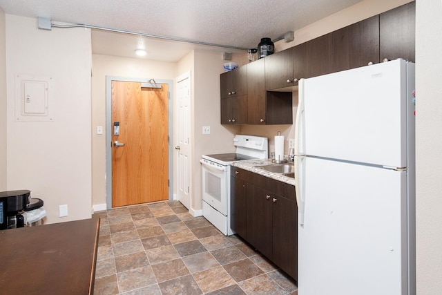 kitchen with white appliances, electric panel, sink, dark brown cabinets, and a textured ceiling