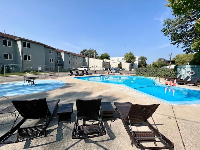 view of swimming pool with a patio