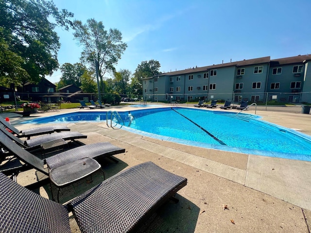 view of swimming pool featuring a patio