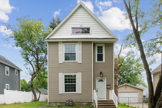 view of front of home with an outdoor structure and a garage