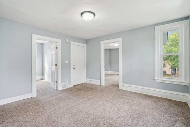 unfurnished bedroom featuring carpet