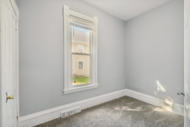 unfurnished room featuring carpet flooring