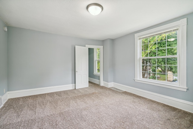 view of carpeted spare room