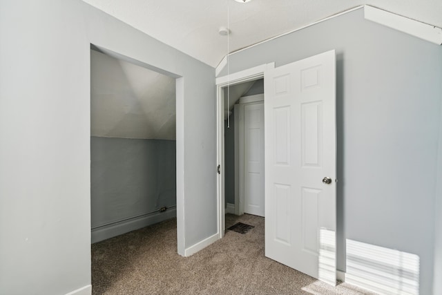 bonus room featuring carpet floors and vaulted ceiling