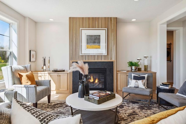 10291 Shadyview Ln N, Maple Grove, MN 55311 - living room with recessed lighting, a glass covered fireplace, and wood finished floors