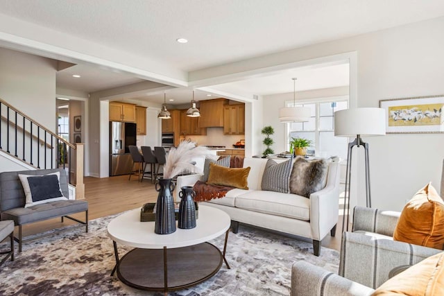 10291 Shadyview Ln N, Maple Grove, MN 55311 - living room featuring light wood-style floors, recessed lighting, beam ceiling, and stairs