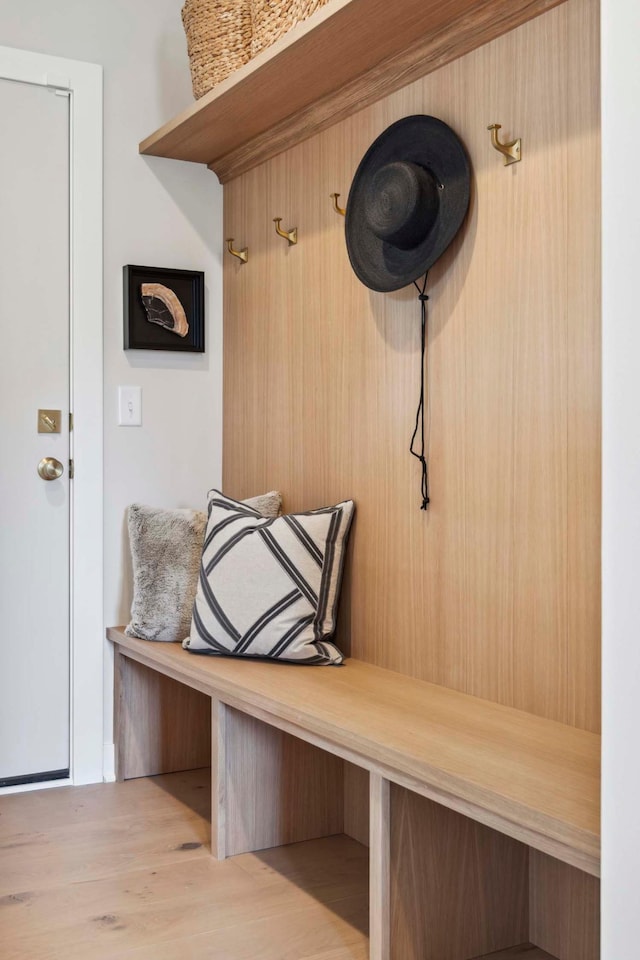 mudroom with light hardwood / wood-style floors