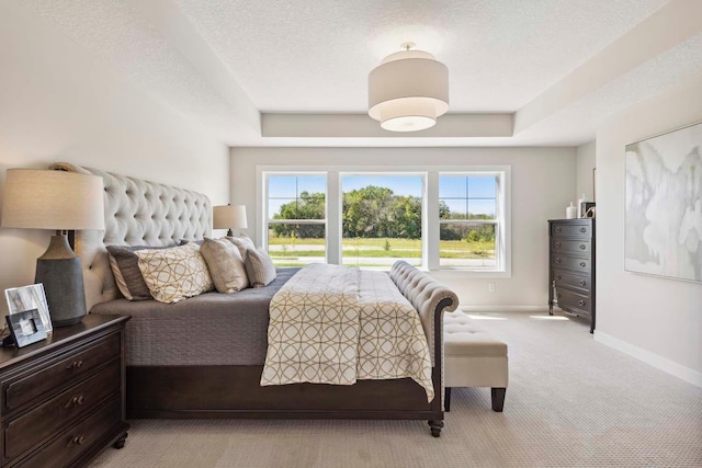 carpeted bedroom featuring a textured ceiling