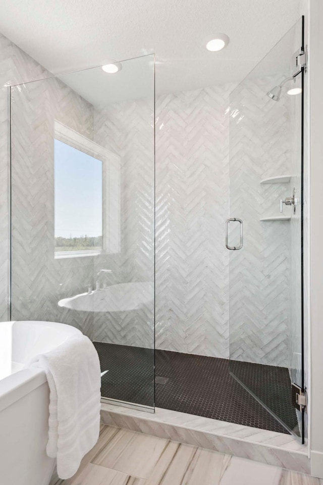 10291 Shadyview Ln N, Maple Grove, MN 55311 - bathroom with a stall shower, a tub to relax in, and recessed lighting