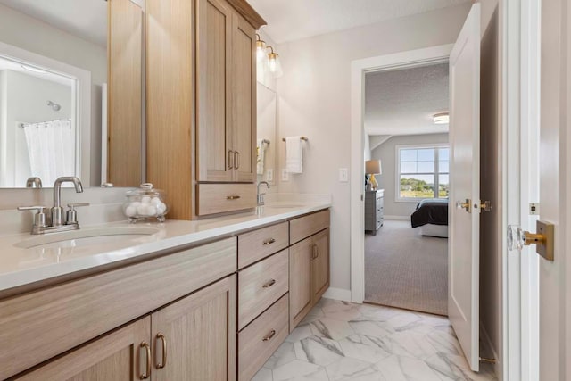 bathroom with vanity and a textured ceiling