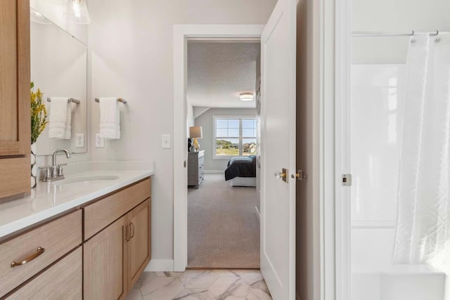 bathroom with vanity, a textured ceiling, and a shower with shower curtain