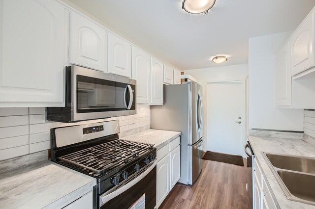 kitchen featuring white cabinetry and stainless steel appliances