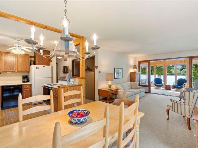 carpeted dining space featuring ceiling fan