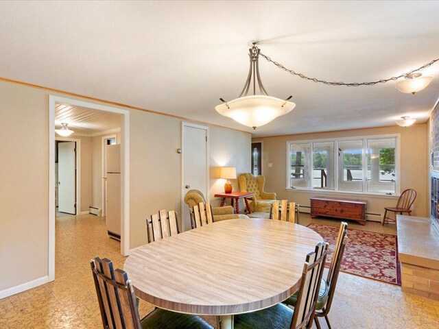 dining space featuring a baseboard radiator