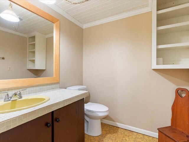 bathroom with ornamental molding, wood ceiling, vanity, and toilet