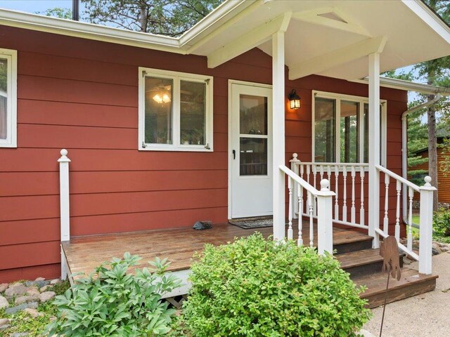 doorway to property featuring a porch