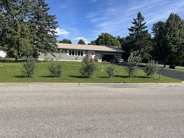 ranch-style house with a front yard