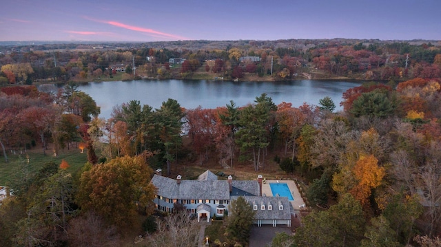 aerial view at dusk with a water view