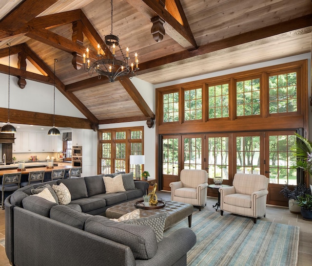 living room featuring high vaulted ceiling, french doors, a wealth of natural light, and beamed ceiling