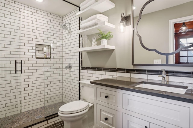 bathroom with a shower with shower door, backsplash, tile walls, and vanity