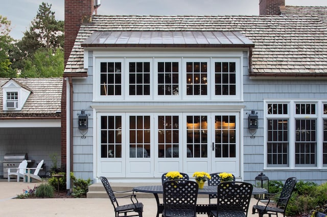 rear view of house featuring french doors and a patio