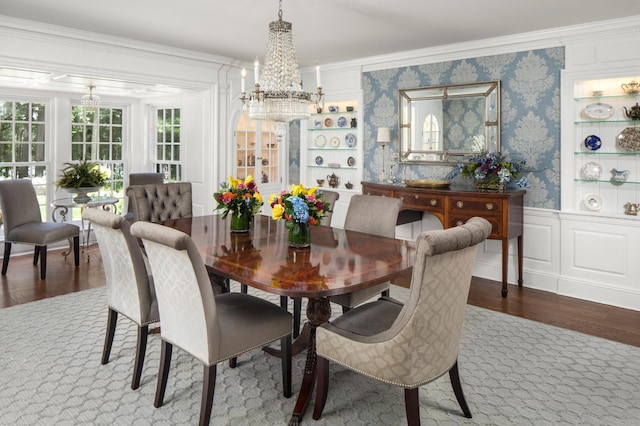 357 Salem Church Rd, Sunfish Lake, MN 55118 - dining space with an inviting chandelier, crown molding, wainscoting, wood finished floors, and wallpapered walls