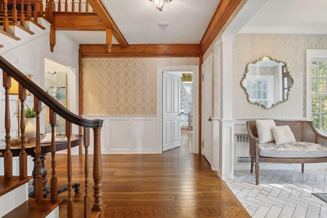357 Salem Church Rd, Sunfish Lake, MN 55118 - entrance foyer featuring wood-type flooring, crown molding, a decorative wall, stairway, and wallpapered walls
