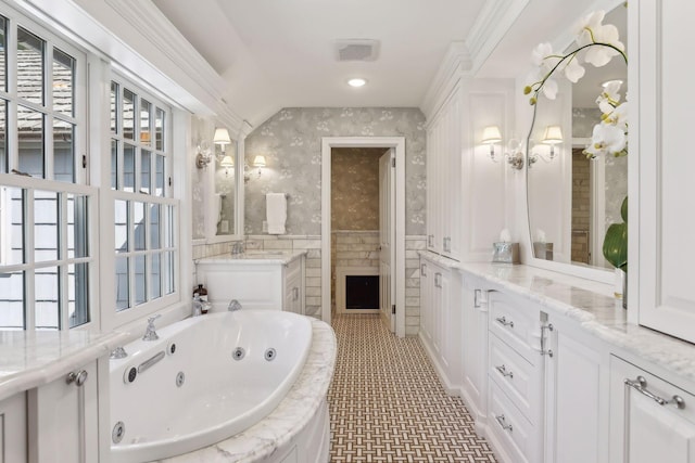 357 Salem Church Rd, Sunfish Lake, MN 55118 - bathroom featuring visible vents, vanity, wallpapered walls, a tub with jets, and vaulted ceiling