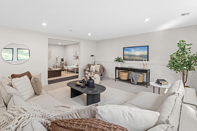 living room featuring light colored carpet