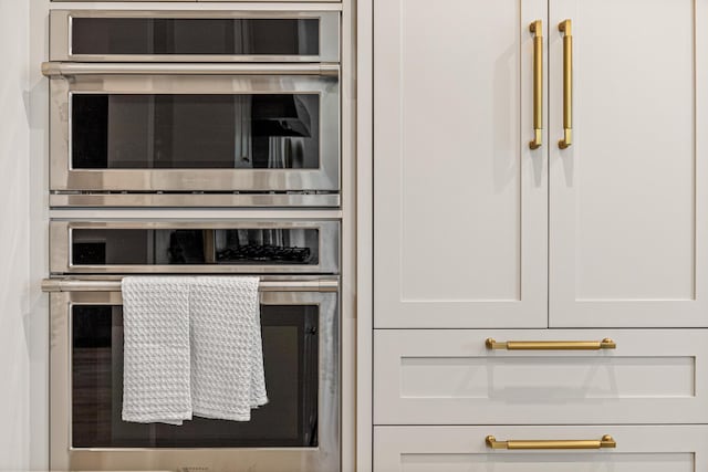 interior space with double oven and white cabinets