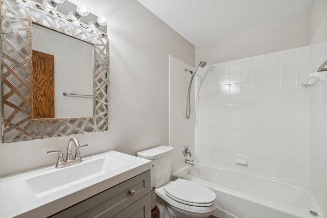 full bathroom with vanity, toilet, and tiled shower / bath