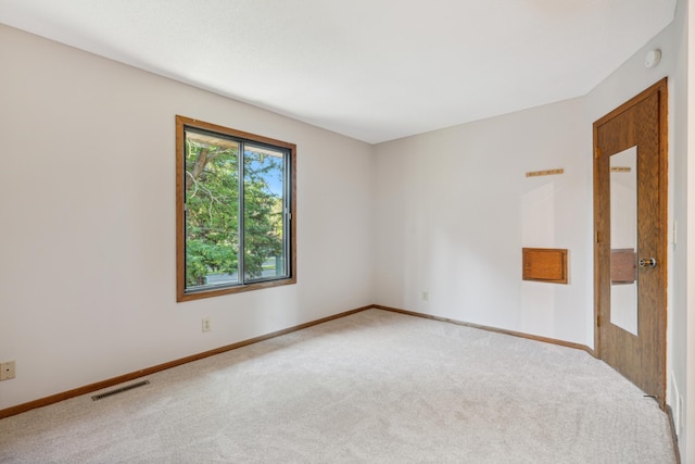 empty room with carpet flooring