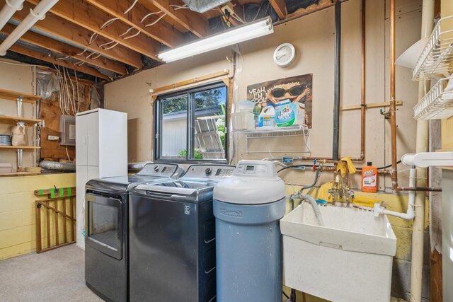 laundry area featuring separate washer and dryer and sink