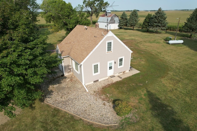 birds eye view of property featuring a rural view