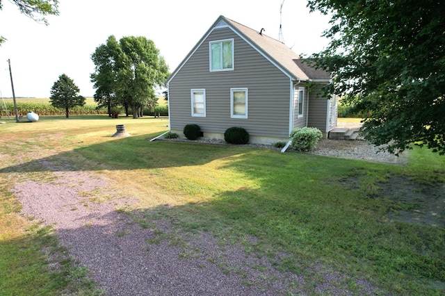 view of home's exterior featuring a lawn