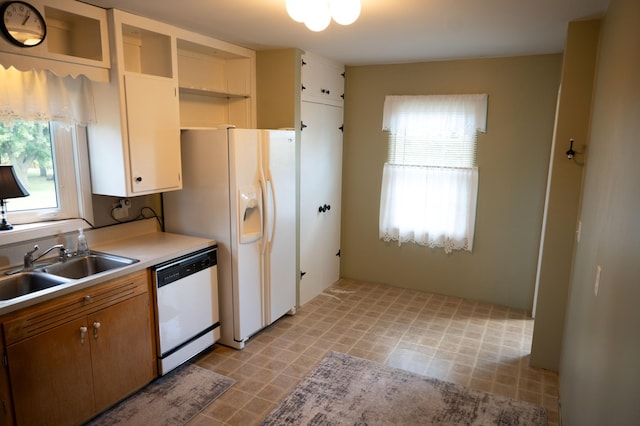 kitchen featuring sink and white appliances