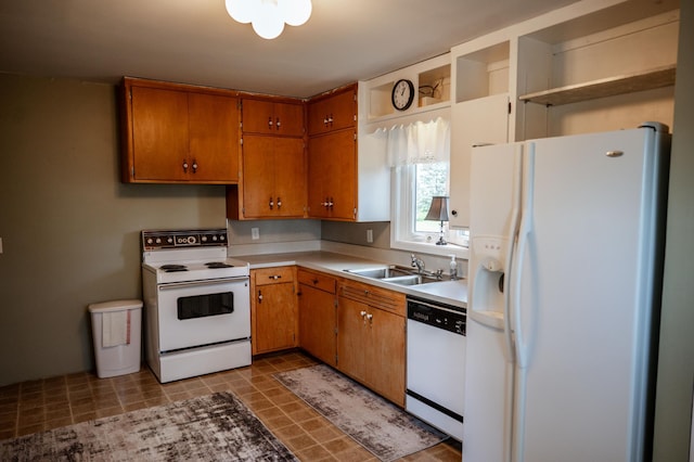 kitchen with white appliances and sink