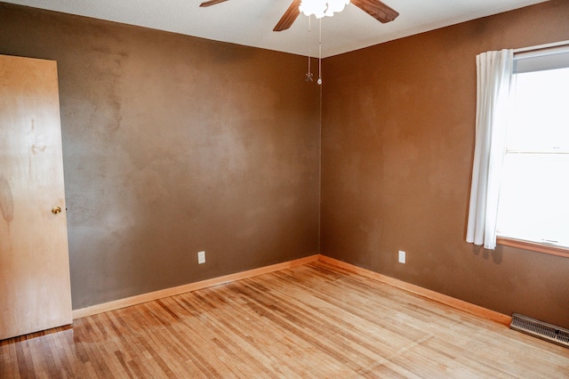 unfurnished room featuring ceiling fan and light hardwood / wood-style floors