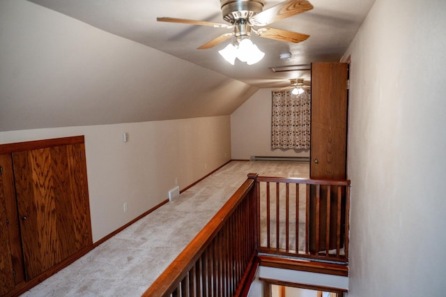 bonus room with vaulted ceiling, ceiling fan, and a baseboard radiator