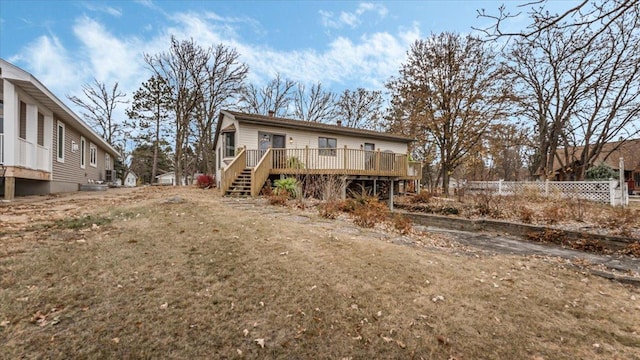 back of property featuring a deck