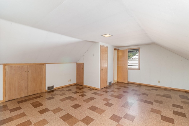 bonus room featuring lofted ceiling