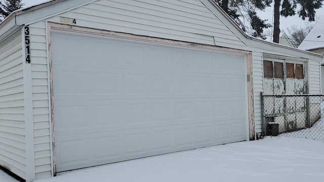 view of snow covered garage