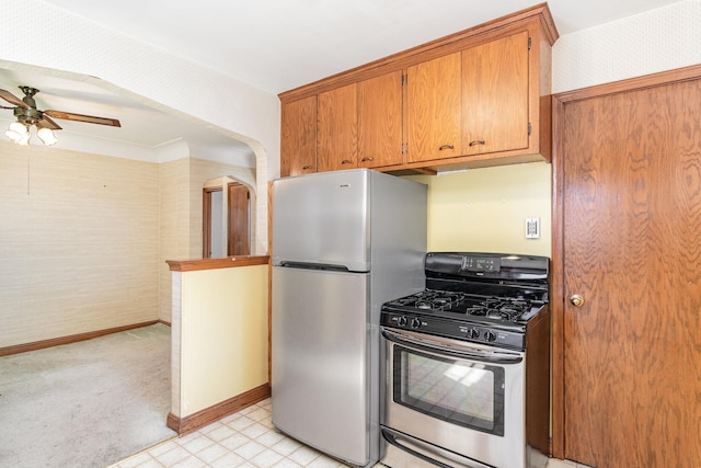 kitchen with ceiling fan and appliances with stainless steel finishes