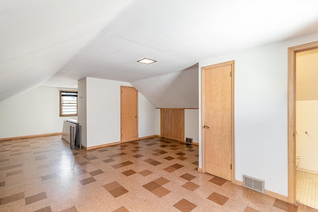 additional living space with lofted ceiling