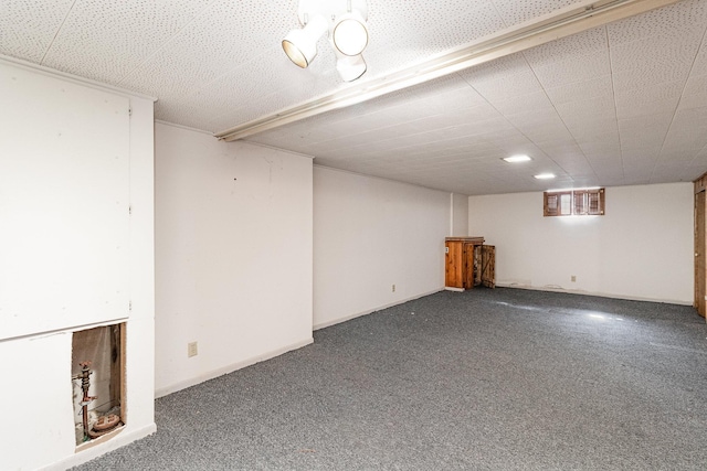 basement featuring carpet flooring