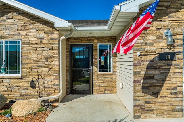 doorway to property featuring a patio