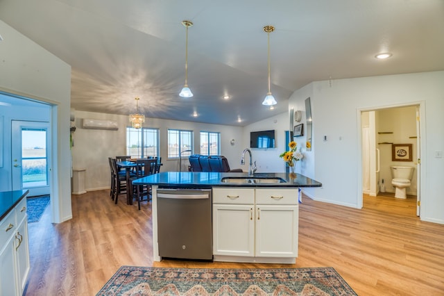 kitchen with sink, white cabinetry, decorative light fixtures, an AC wall unit, and dishwasher