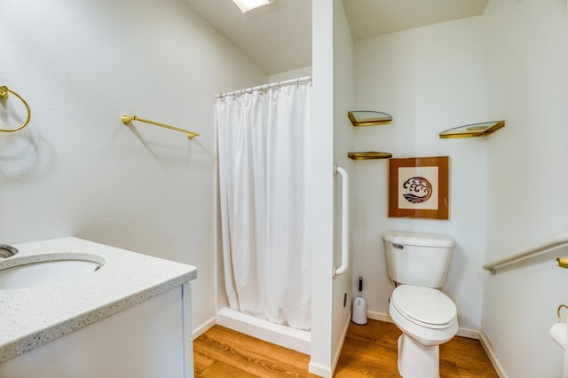 bathroom with hardwood / wood-style flooring, toilet, and a shower with shower curtain