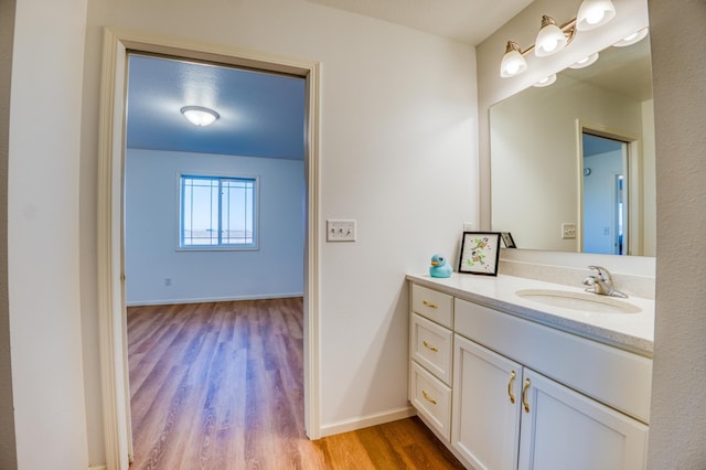 bathroom featuring vanity and wood-type flooring