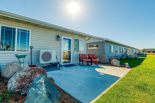 back of house with ac unit, a lawn, and a patio area